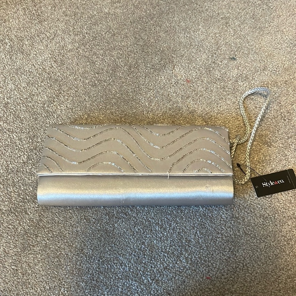 Gray purse with beads on the front